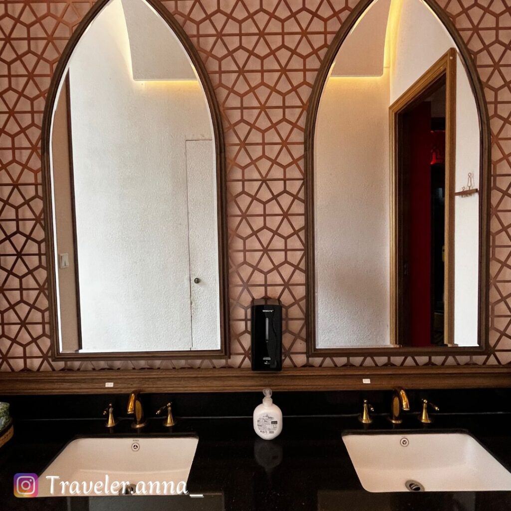 a bathroom with two sinks and mirrors